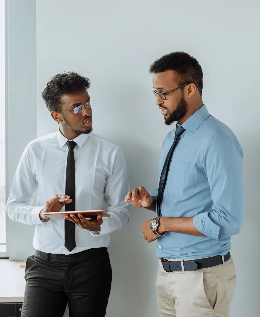 Colleagues reviewing business activity on a tablet