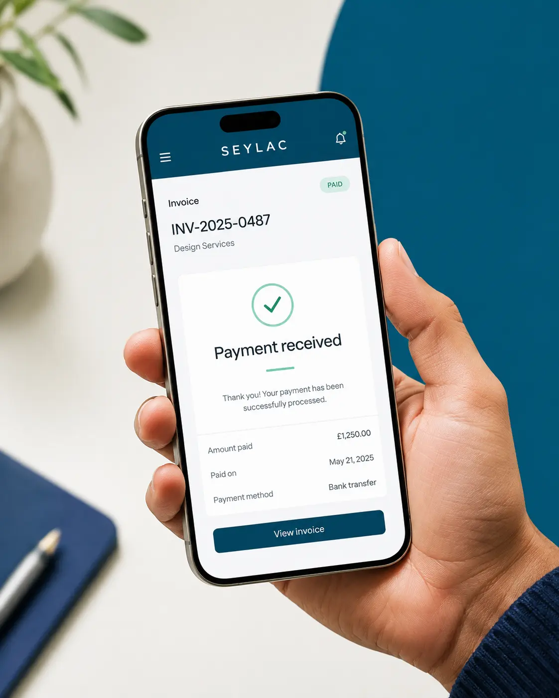Seylac invoice marked as payment received on a mobile phone
